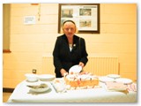 18 Margaret McLoughlin cutting the Anniversary Cake